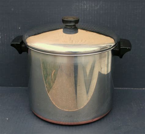 Put the pot or pan to be cleaned into the larger pot and let it soak in the boiling water for a while. . Revere ware copper bottom pots